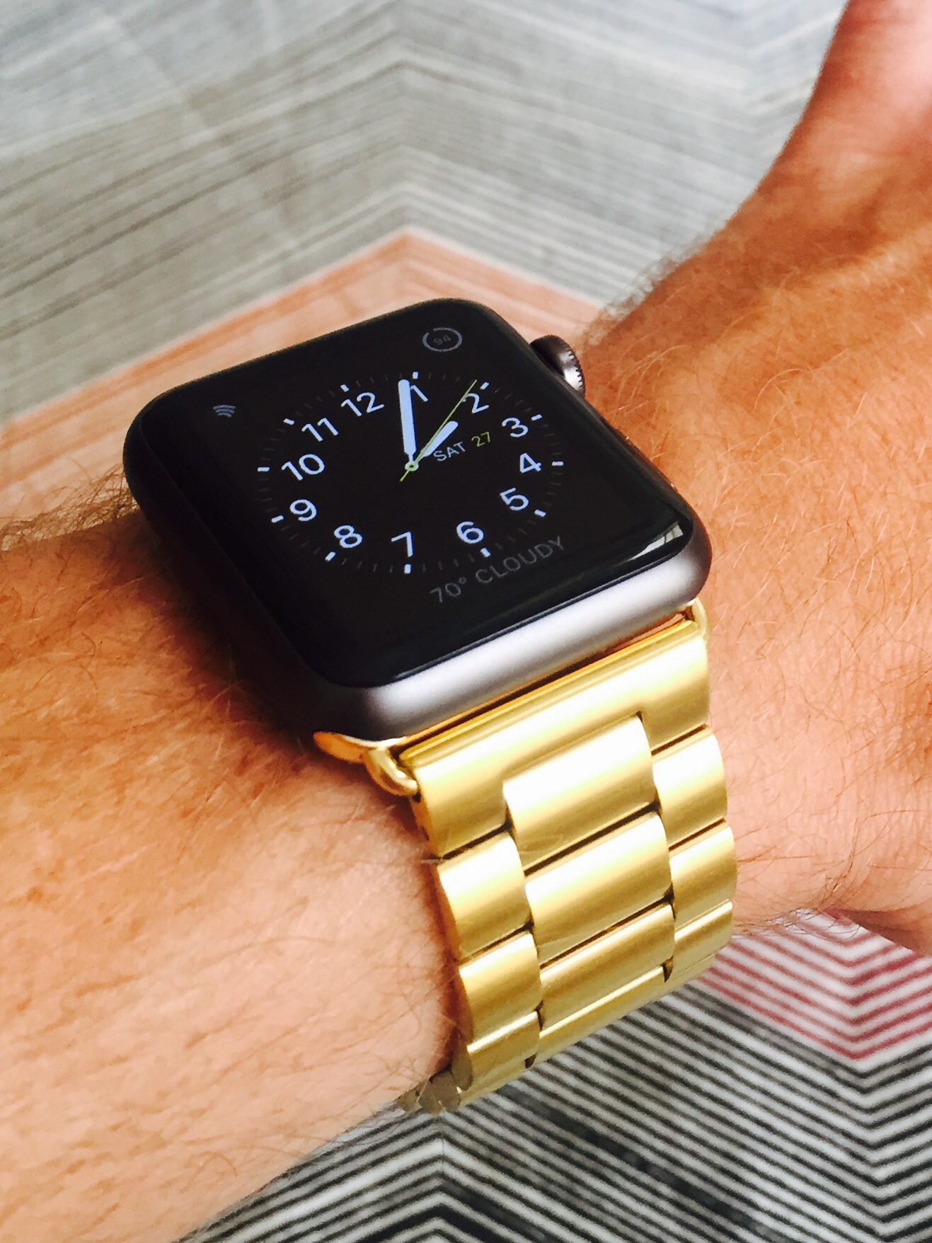 space gray apple watch with gold band