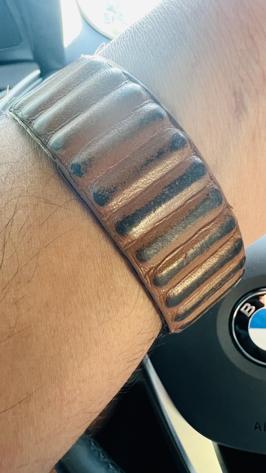 Anyone know how to remove these black marks from apple leather link band?