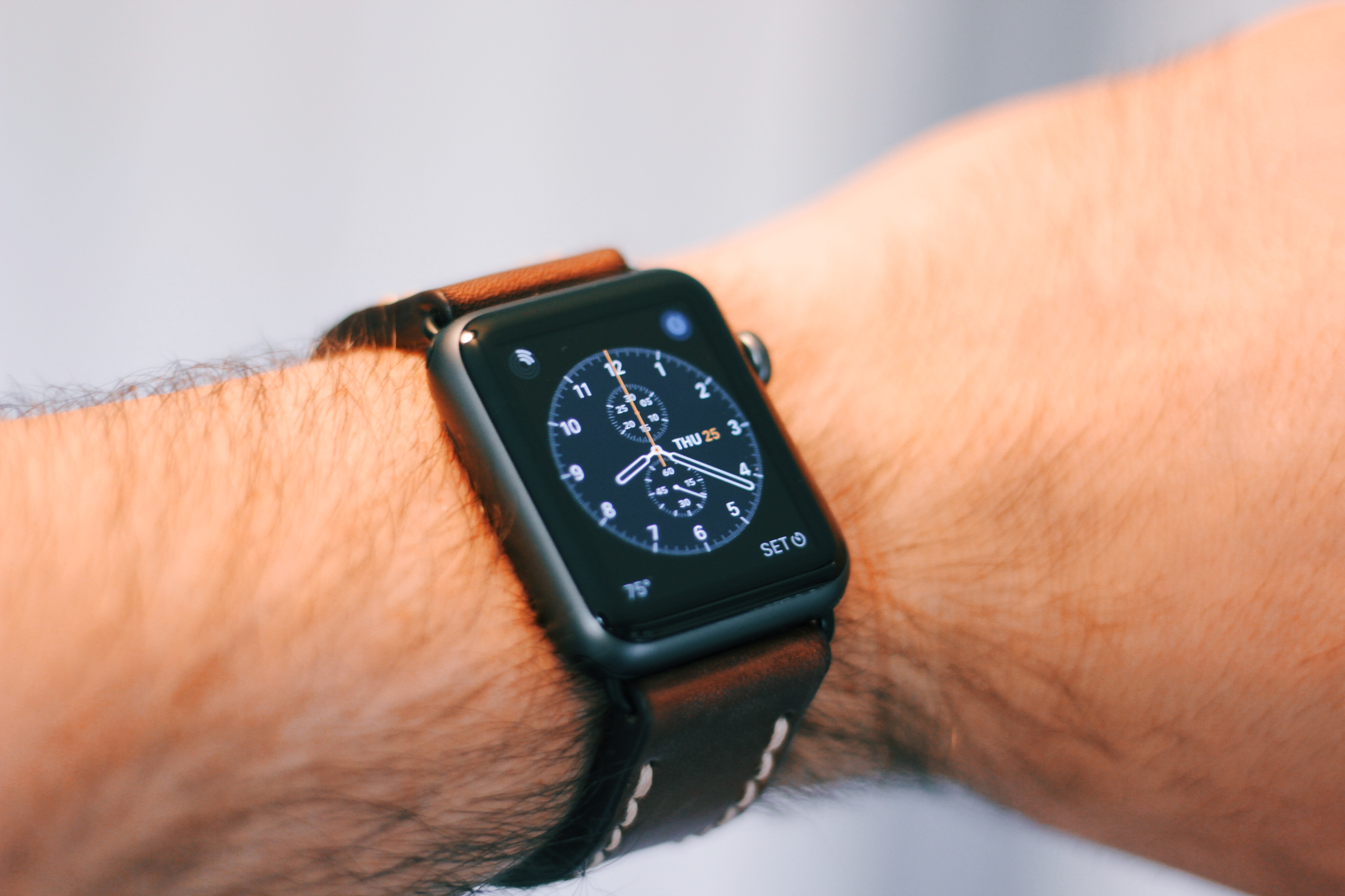 space grey watch with white band