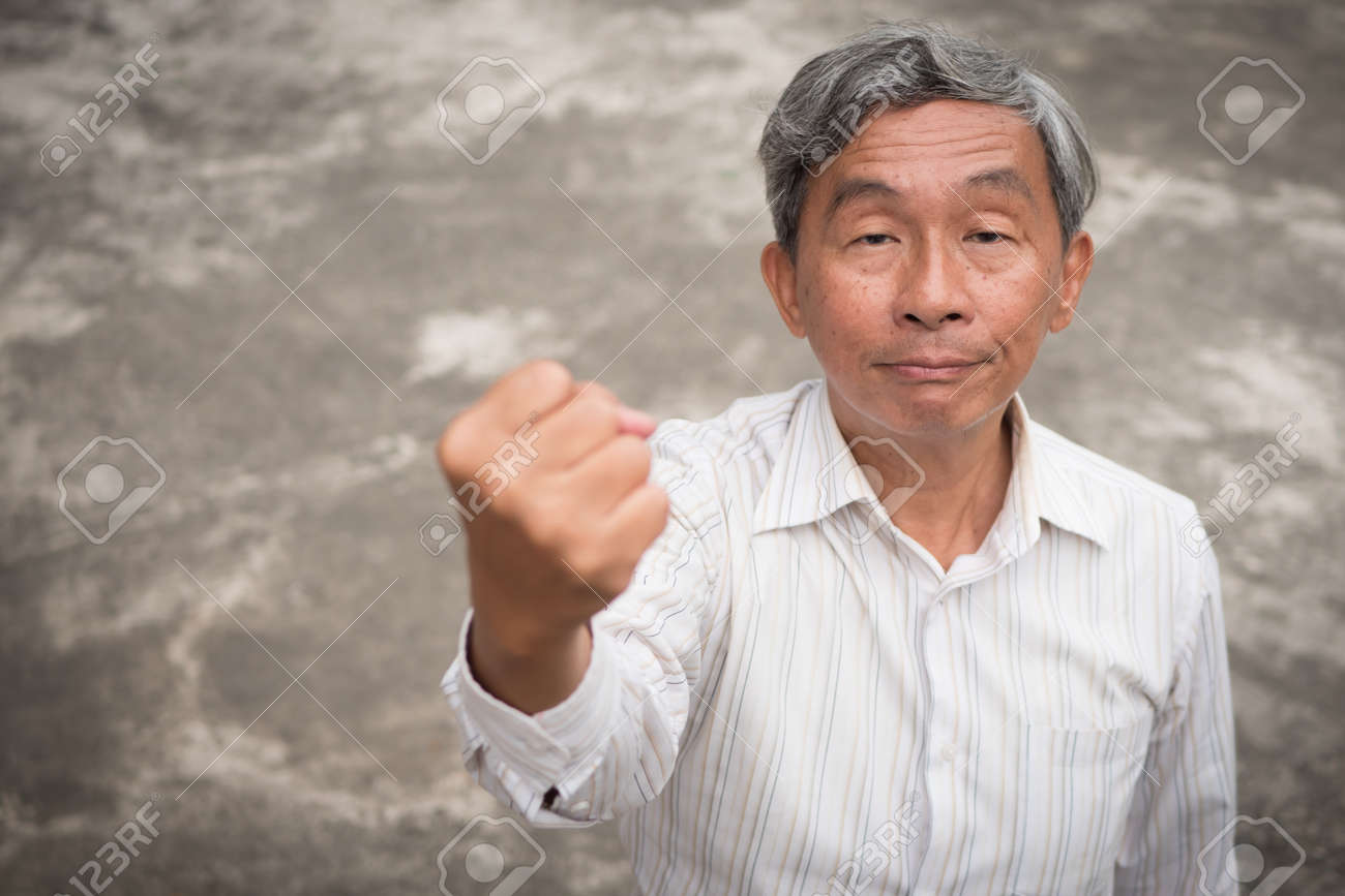 94573804-angry-hostile-aggressive-old-man-senior-man-clenching-his-fist-ready-to-attack.jpg