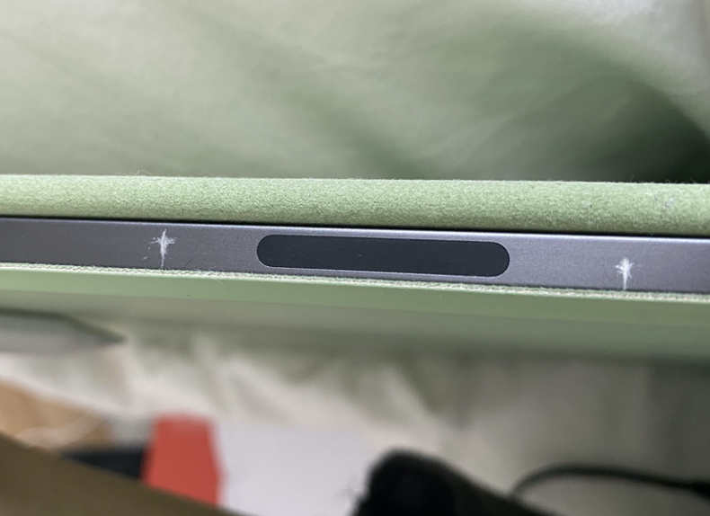 How do I prevent scratches on my iPad?