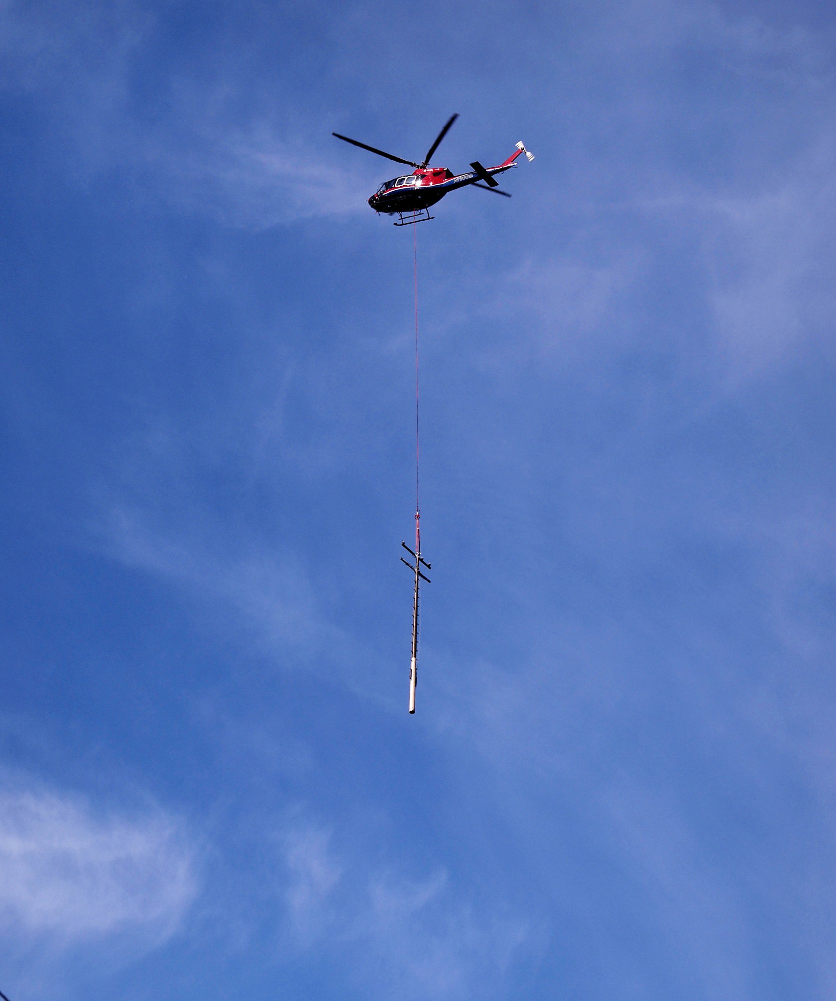 helicopter carry phone pole x.jpg