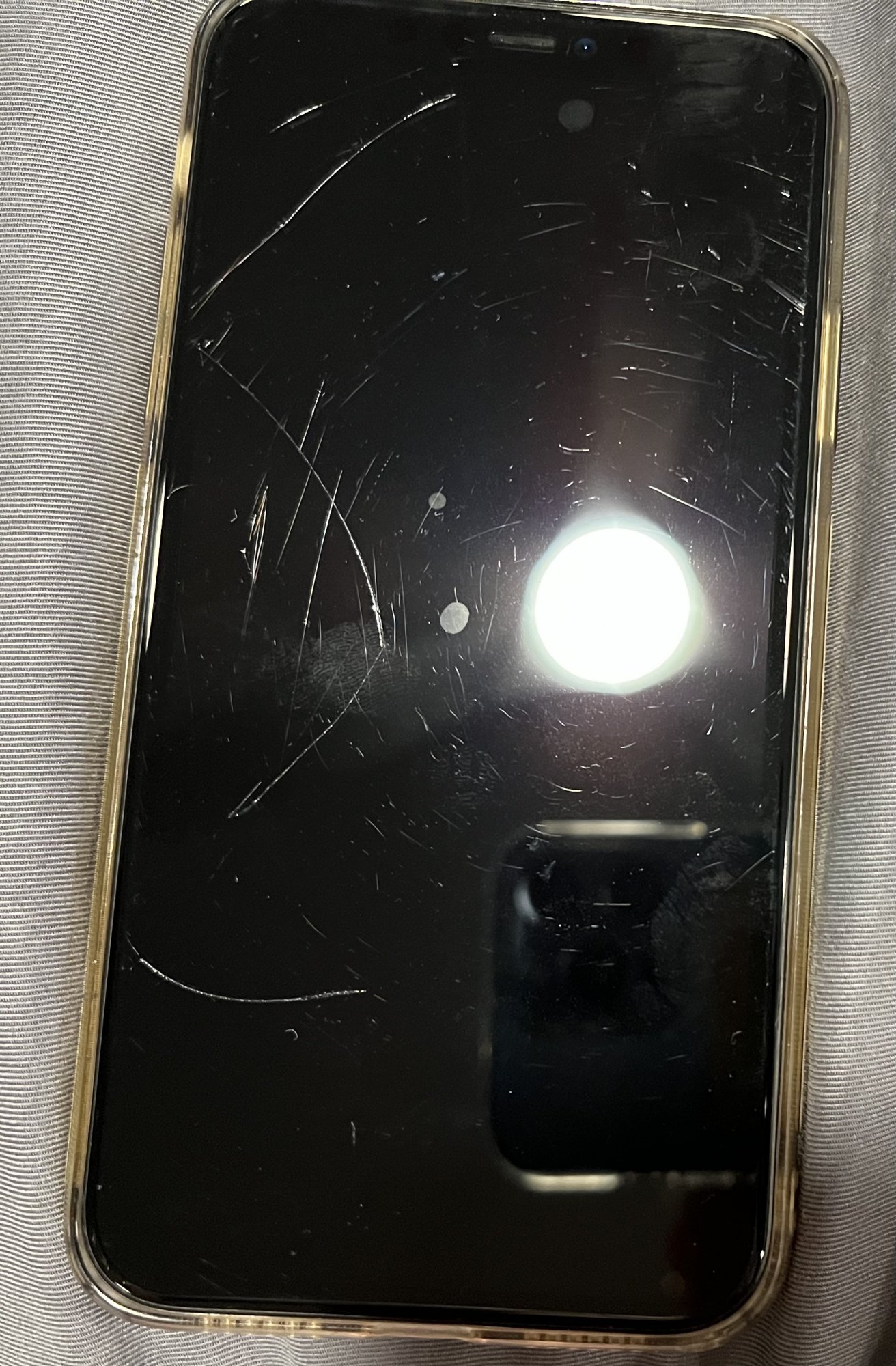 Why do new iPhone screens scratch so easily?