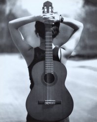 1612787~Young-Woman-Holding-an-Acoustic-Guitar-Behind-Her-Back-Posters.jpg