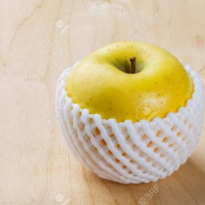 26505711-close-up-toki-japanese-apple-with-fruit-protection-foam-on-wooden-table.jpg