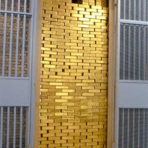 Gold_Bars_Stacked_in_a_Vault.jpg