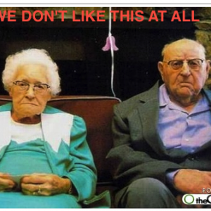 Frowning old couple.png
