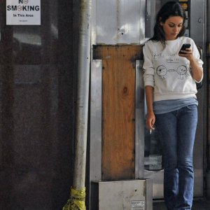 56408-mila-kunis-on-a-smoke-break-on-friends-with-.jpg
