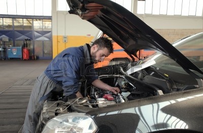 6960682-mechanician-working-a-car-engine.jpg