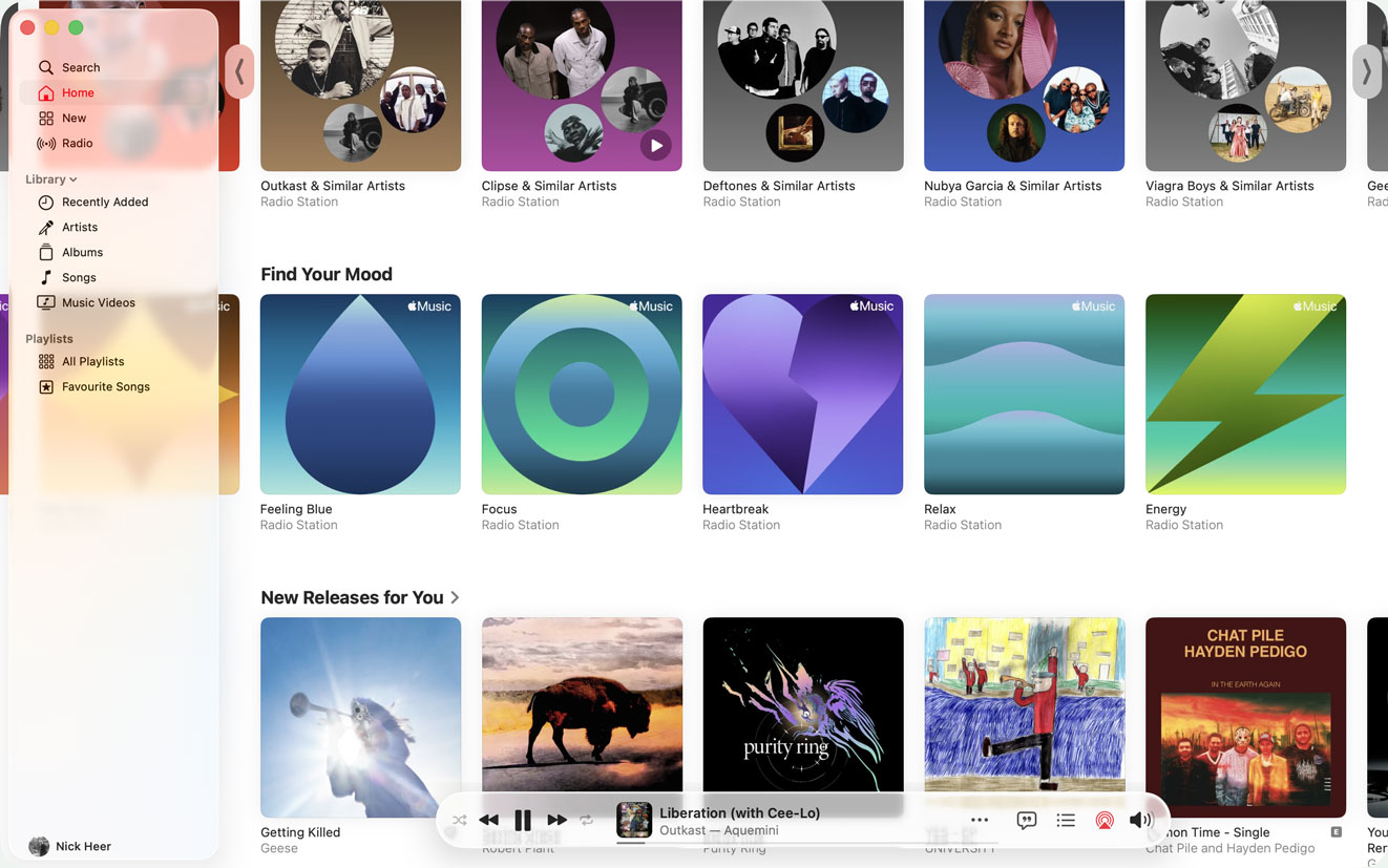 The Music app, with a couple of rows of tiles scrolled horizontally so some of the tiles are underneath the sidebar.