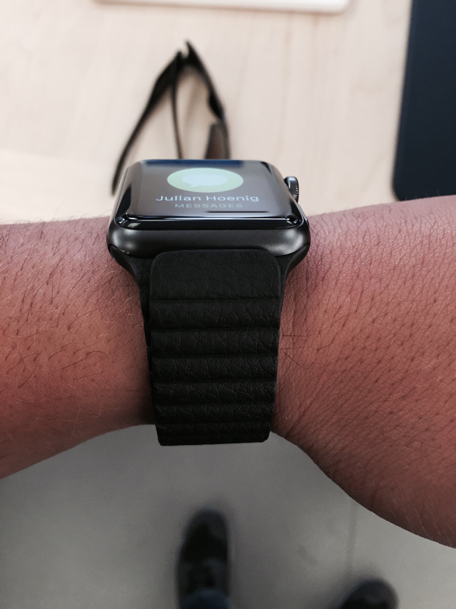 space gray apple watch with leather band