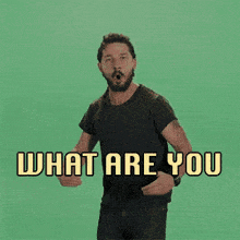 a man in a black shirt says  what are you waiting for  on a green background