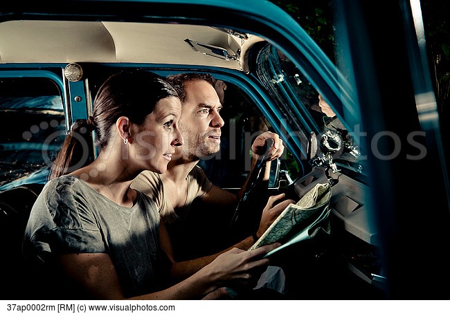 couple_reading_map_in_car_at_night_37ap0002rm.jpg