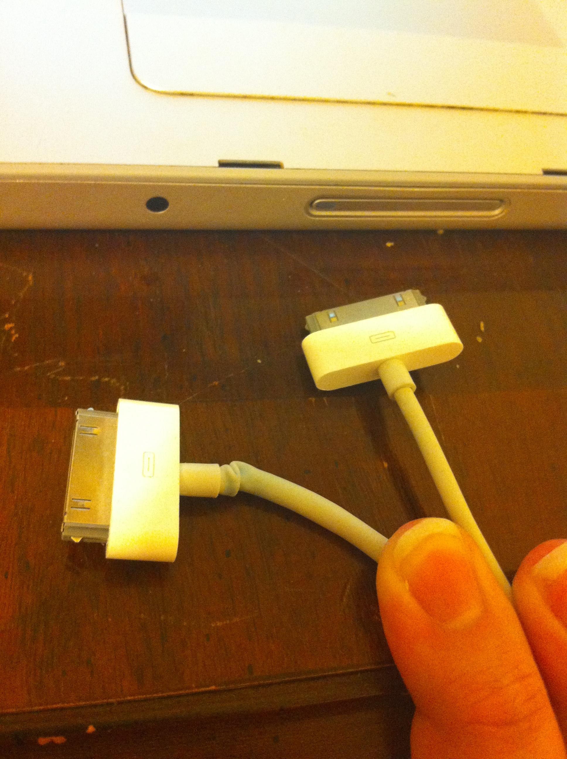 Anyone else's dock connector that came with the iPhone 4 tearing up