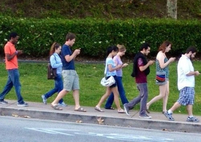 group-of-people-walking-and-texting.jpg